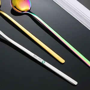 Three 304 stainless steel coffee spoons in silver, gold and rainbow colors on black background