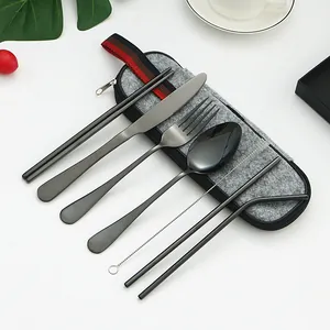 Portable 8-piece black stainless steel cutlery set with a grey felt zipper carry bag