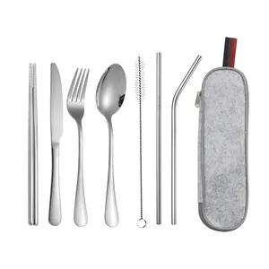 8-piece portable stainless steel travel cutlery set with gray felt storage bag on white base