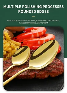 Close-up of polished gold stainless steel dinner and dessert spoons with smooth edges
