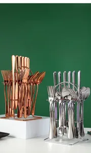 Polished stainless steel cutlery set in rose gold and silver finish with metal storage rack