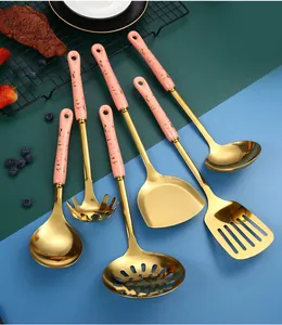 Detail of 6-piece pink marble handle stainless steel kitchen utensil set with gold finish