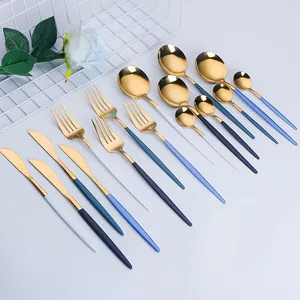 Golden stainless steel cutlery set with colorful matte handles for modern dining table