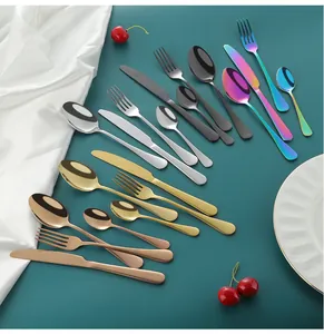 Close-up of multicolor stainless steel cutlery set with mirror finish in diverse colors