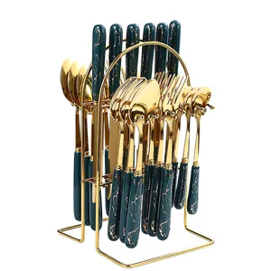 24-piece gold stainless steel cutlery set with green marble handles and metal storage rack