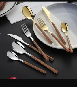 Macro detail of high-quality stainless steel cutlery with realistic wood grain handles