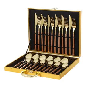 24-piece gold stainless steel cutlery set with wood grain handles in a gold gift box