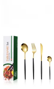 Detail of 20-piece luxury Portuguese flatware set with gold heads and black handles