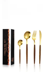 24-piece gold stainless steel cutlery set with wood-grain handles in a black gift box
