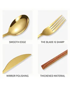 Detail view of gold stainless steel cutlery with wood-grain handles and mirror polish