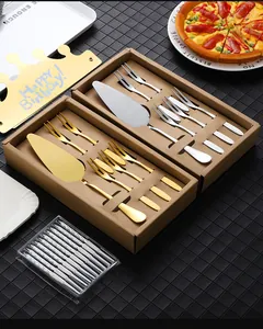 Flat lay of gold and silver cake server sets with dessert forks and birthday candles