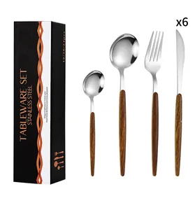 Detail view of a 24-piece stainless steel cutlery set with wood-grain handles in a black gift box