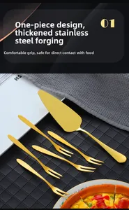 Close-up of golden stainless steel cake shovel and fruit forks with brushed finish