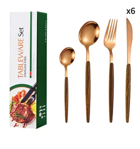 Close-up of 24-piece rose gold stainless steel cutlery set with dark wood grain handles