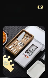 Detail of stainless steel cake server set with forks, birthday hat and candle in a box