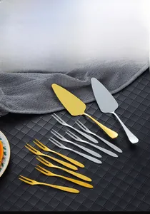 Polished stainless steel cake server and two-prong fruit fork set in gold and silver