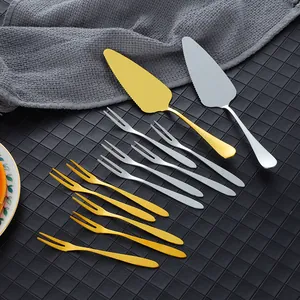 Polished stainless steel cake server and fruit fork set in gold and silver finish