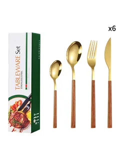 Detail of 24-piece golden stainless steel cutlery set with faux wood handles and gift box