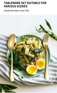 Close-up of golden stainless steel fork and spoon on a modern dining plate