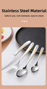 Detail of stainless steel cutlery set with elegant gold diamond pattern handles