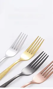 Detail view of four-color stainless steel forks with diamond textured handles and smooth teeth