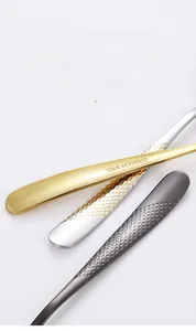 Detailed view of stainless steel cutlery handles with textured diamond pattern finish