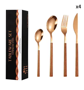 Rose gold stainless steel cutlery set with wood handles in an elegant black gift box