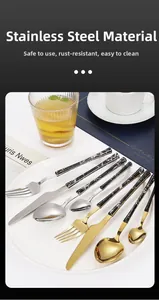 Detailed set of marble pattern handle cutlery displayed on a white ceramic dining plate