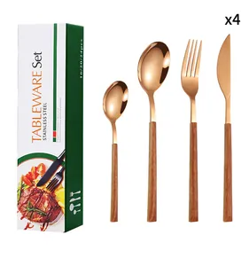 Detail of rose gold stainless steel cutlery set with wood-textured handles in box