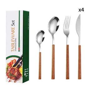Detail of 4-piece stainless steel cutlery set with wood-texture handles and packaging box