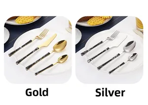 Detail view of 4-piece stainless steel cutlery with black marble pattern handles in gold and silver