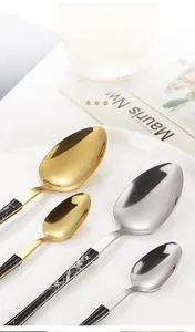 Detailed close-up of thickened stainless steel spoons with marble texture handles