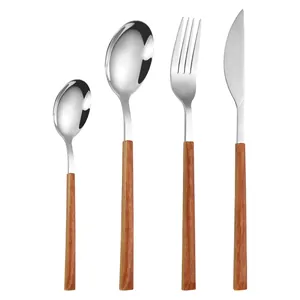 Modern 4-piece stainless steel cutlery set with elegant wood grain handles on white background