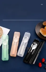 Detail of portable 304 stainless steel cutlery set with spoons and chopsticks in cases