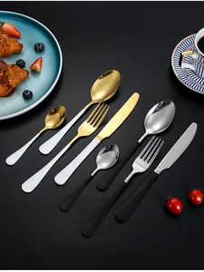 Detail of 24-piece gold and silver stainless steel cutlery set with elegant handles