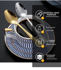 Detailed view of luxury gold and silver stainless steel spoons with striped handles