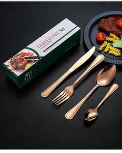 Close-up of rose gold stainless steel cutlery set with knife, fork, and spoons in gift box