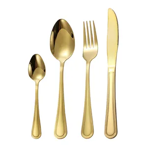 Modern 4-piece gold stainless steel cutlery set with elegant parallel groove handle design