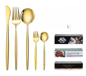 Macro detail of 30-piece gold stainless steel cutlery set with elegant slim handles