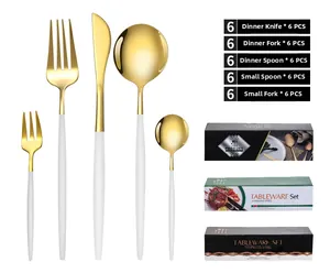 Detailed view of 30-piece gold and white stainless steel cutlery set with elegant gift boxes