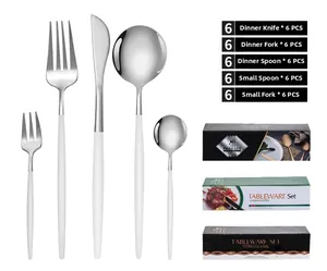 30-piece stainless steel cutlery set with white matte handles and golden heads in gift boxes