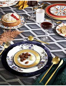 Elegant gold hammered stainless steel cutlery set displayed on a stylish dining table
