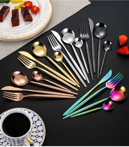 Detailed close-up of 24-piece stainless steel cutlery set with elegant hammered handles