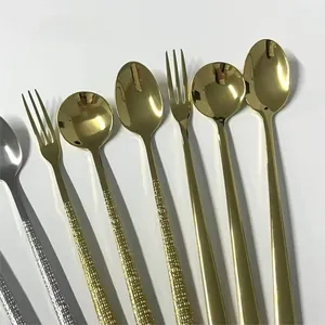 Close-up of polished stainless steel spoon heads with textured anti-slip handles