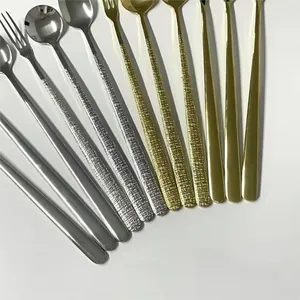 Detail of 304 stainless steel dessert spoons and forks with textured and mirror finish