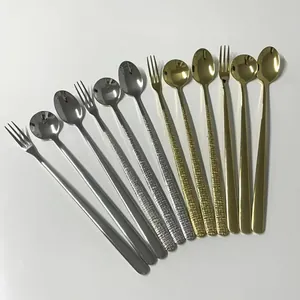 Close-up of 304 stainless steel long handle spoons and fruit forks in gold and silver