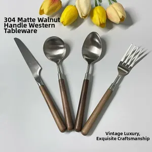 Flat lay of 304 stainless steel cutlery set with walnut handles and matte finish