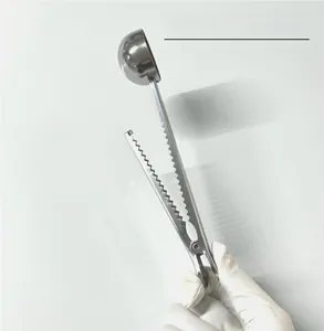 Detail view of 304 stainless steel coffee scoop with integrated sealing clip and strong spring