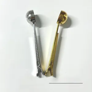 Detail of 304 stainless steel coffee scoop with integrated sealing clip in gold and silver