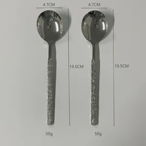 Detailed view of 304 stainless steel spoons with floral and hammered texture handles